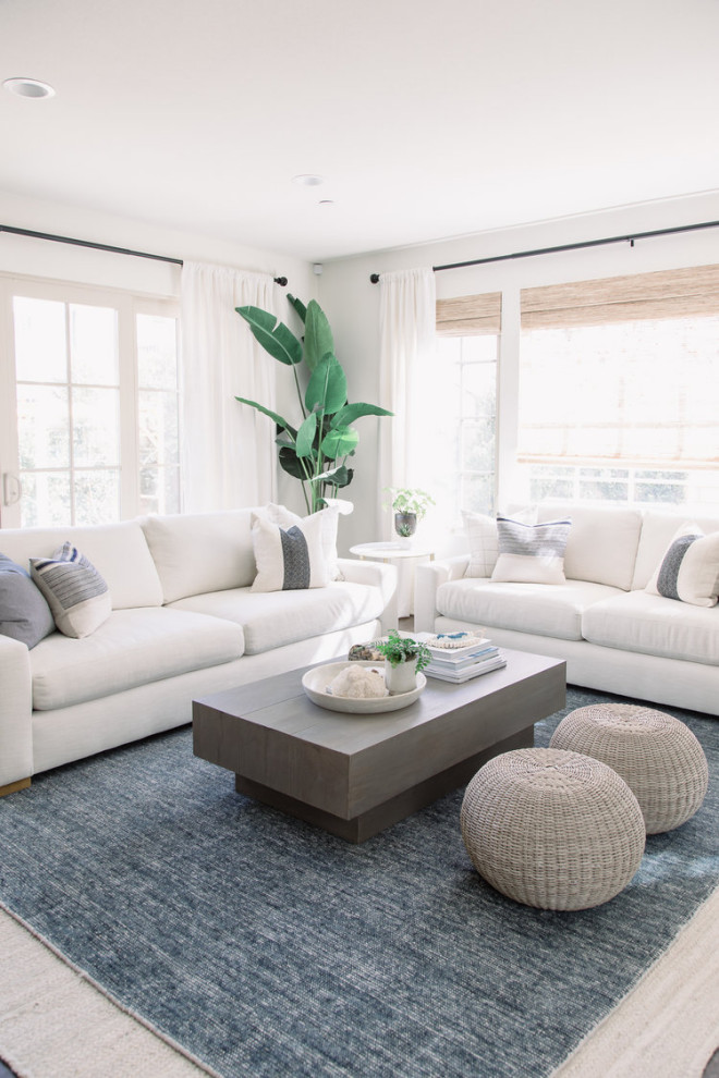 This is an example of a beach style living room in Orange County with grey walls.