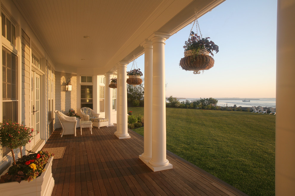 Design ideas for a traditional verandah in Boston with decking and a roof extension.