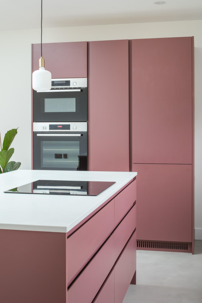 Mid-sized contemporary l-shaped eat-in kitchen in Other with a drop-in sink, flat-panel cabinets, purple cabinets, quartzite benchtops, white splashback, concrete floors, with island, grey floor and white benchtop.