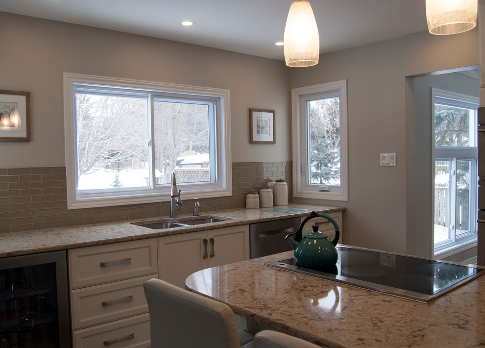 Example of a transitional kitchen design in Ottawa with an island