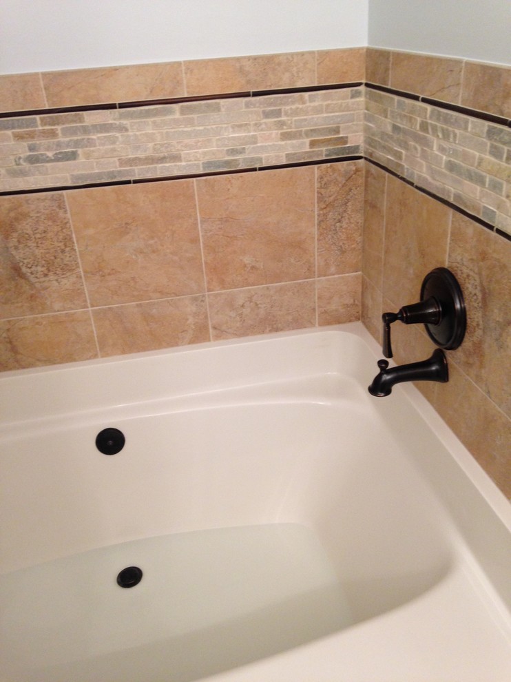 Inspiration for a large transitional master multicolored tile and porcelain tile porcelain tile alcove bathtub remodel in Baltimore with an integrated sink, raised-panel cabinets, white cabinets, solid surface countertops, a two-piece toilet and blue walls