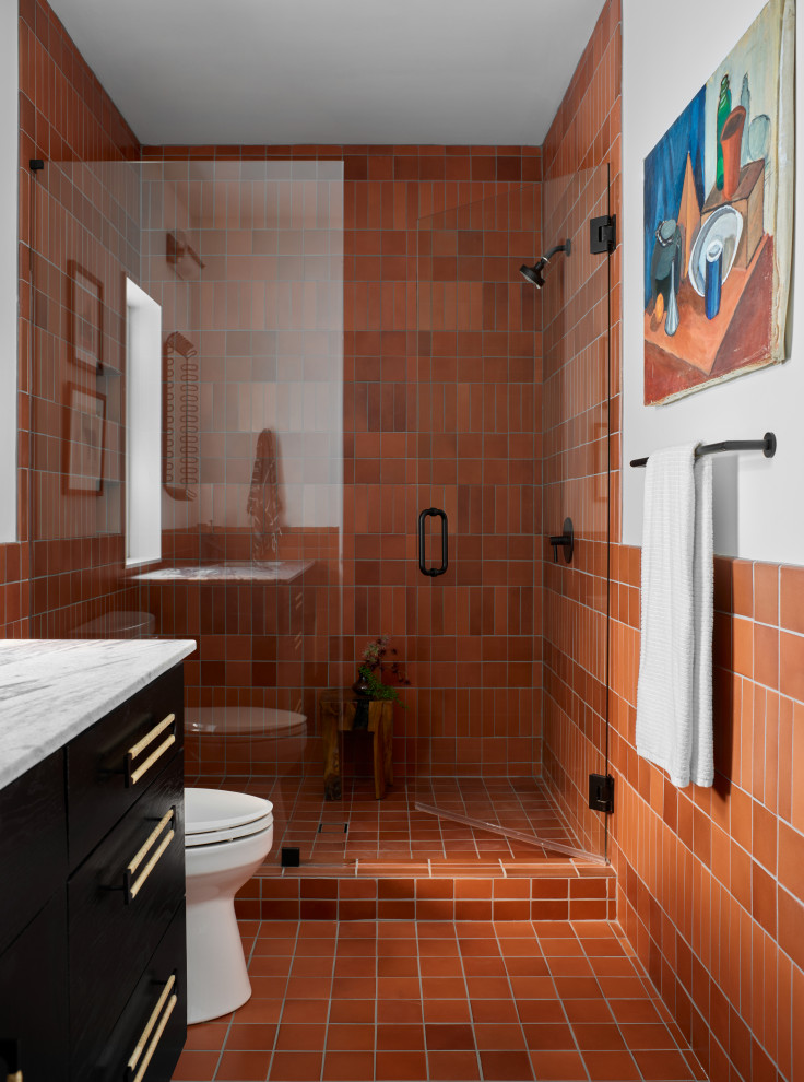 Large modern wet room bathroom in Atlanta with orange tile, ceramic tile, ceramic floors, orange floor and a hinged shower door.