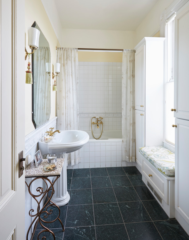 Inspiration for a mid-sized traditional master bathroom in San Francisco with recessed-panel cabinets, white cabinets, an alcove tub, a shower/bathtub combo, white tile, ceramic tile, yellow walls, marble floors, a pedestal sink, green floor and a shower curtain.