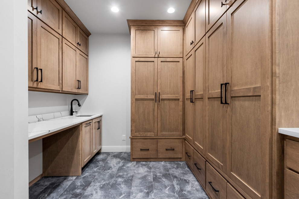 Example of a large transitional vinyl floor and black floor hallway design with white walls