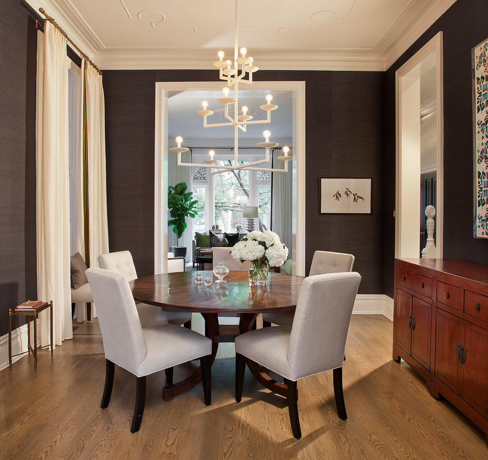 Transitional separate dining room in Chicago with grey walls and medium hardwood floors.