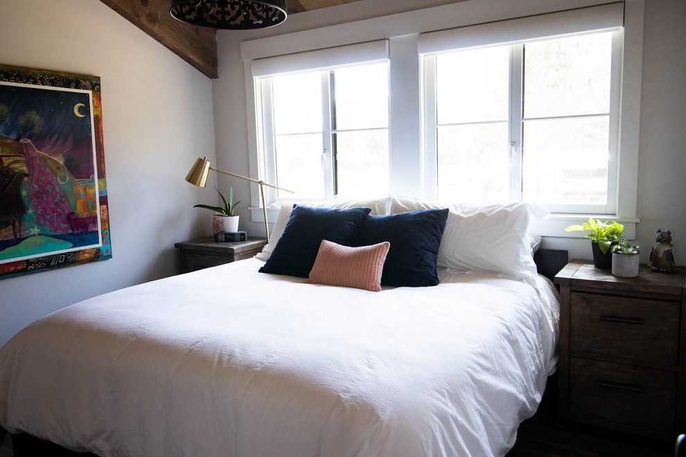 This is an example of a mid-sized country guest bedroom in Minneapolis with white walls.
