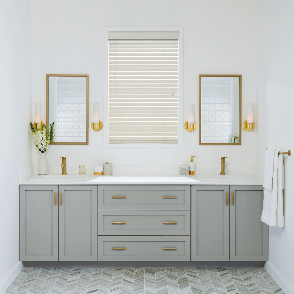 Design ideas for a mid-sized transitional master bathroom in New York with shaker cabinets, grey cabinets, white walls, grey floor, porcelain floors, a drop-in sink, engineered quartz benchtops and white benchtops.
