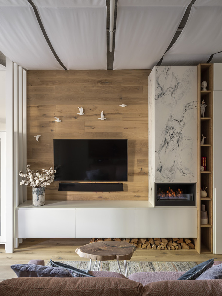 Design ideas for a scandinavian living room in Moscow with beige walls, medium hardwood floors and beige floor.