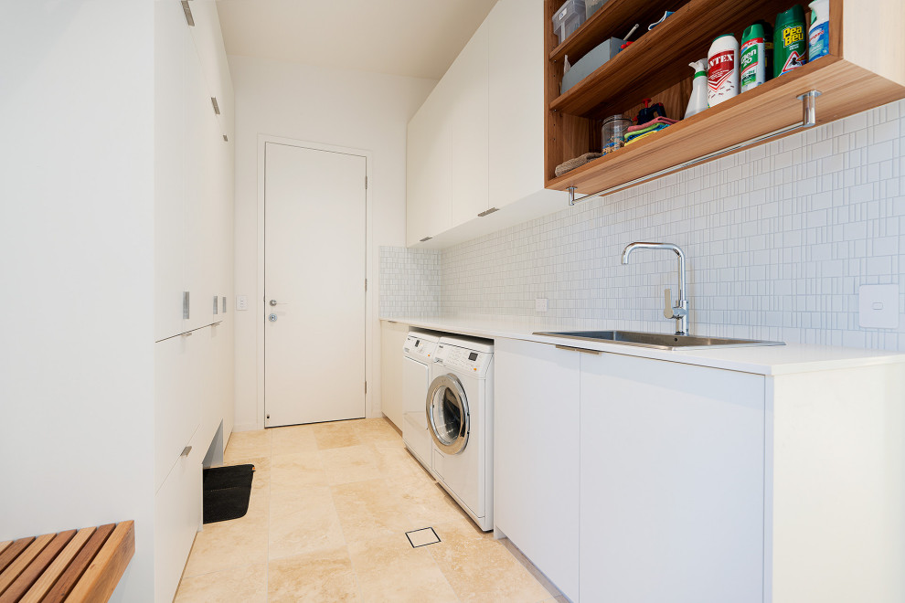 This is an example of a country laundry room in Other.