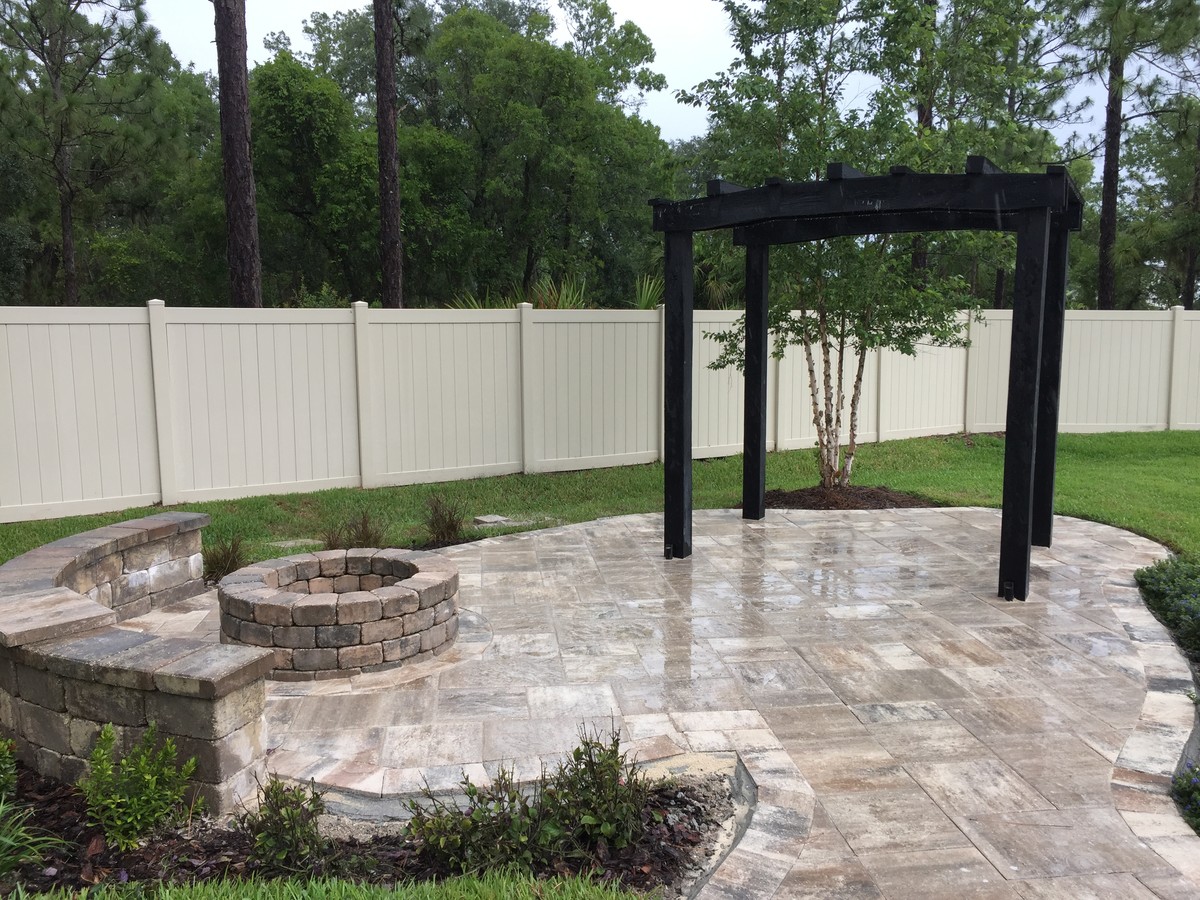 Patio - mid-sized transitional backyard stamped concrete patio idea in Miami with a fire pit and a pergola