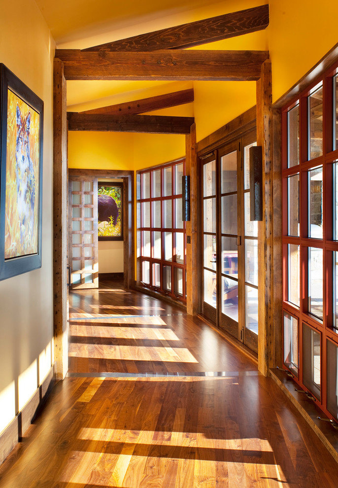 Photo of a country hallway in Other with medium hardwood floors.