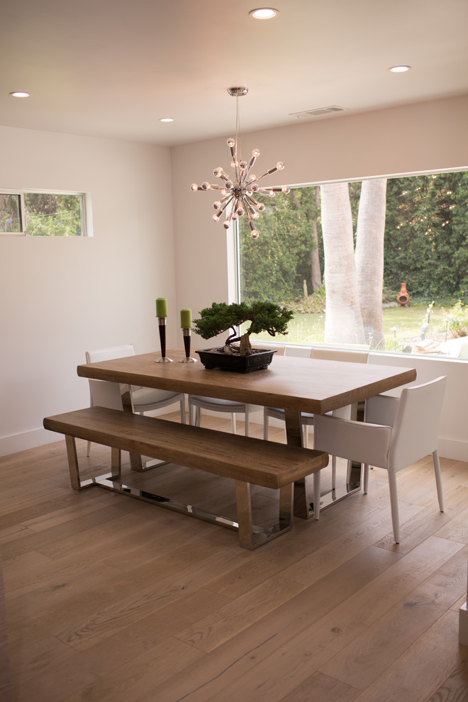 Inspiration for a mid-sized modern open plan dining in Seattle with bamboo floors and brown floor.