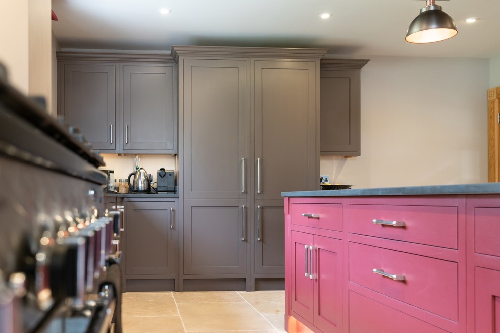 Inspiration for an expansive traditional galley eat-in kitchen in Hertfordshire with a drop-in sink, recessed-panel cabinets, brown cabinets, quartzite benchtops, panelled appliances, terra-cotta floors, with island, beige floor and grey benchtop.