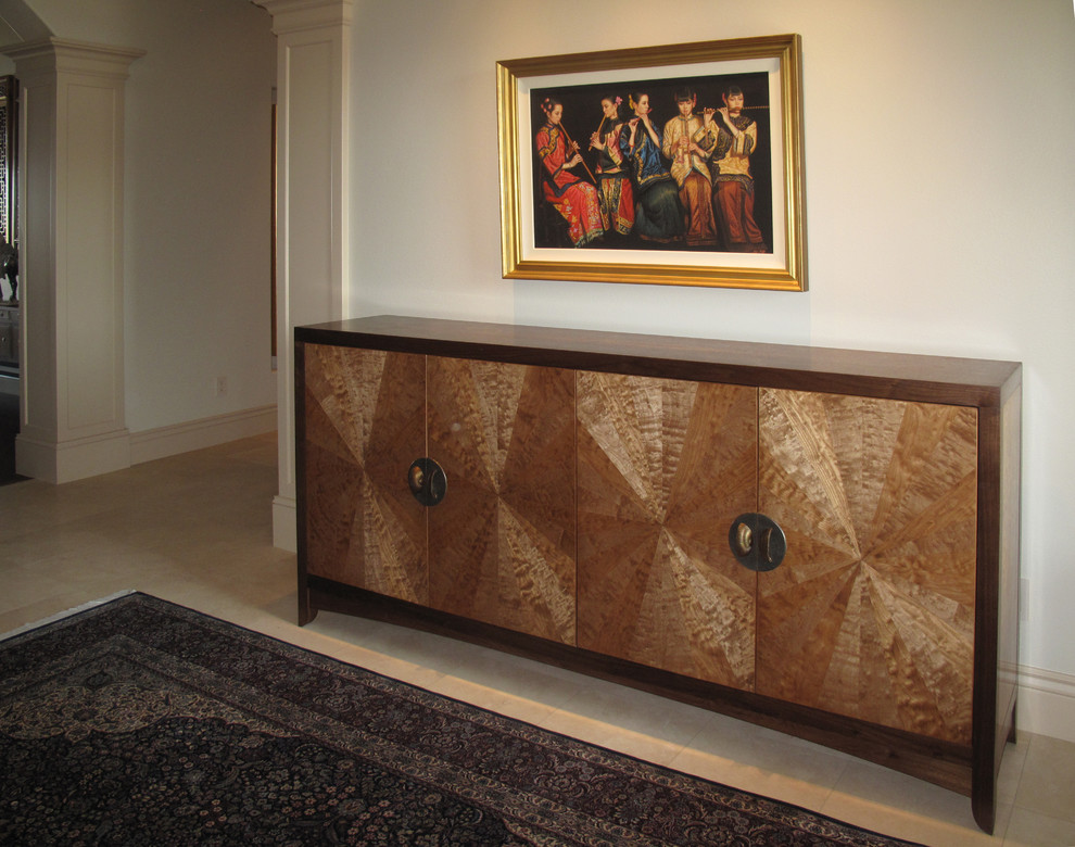 This is an example of a mid-sized asian foyer in Other with white walls and travertine floors.