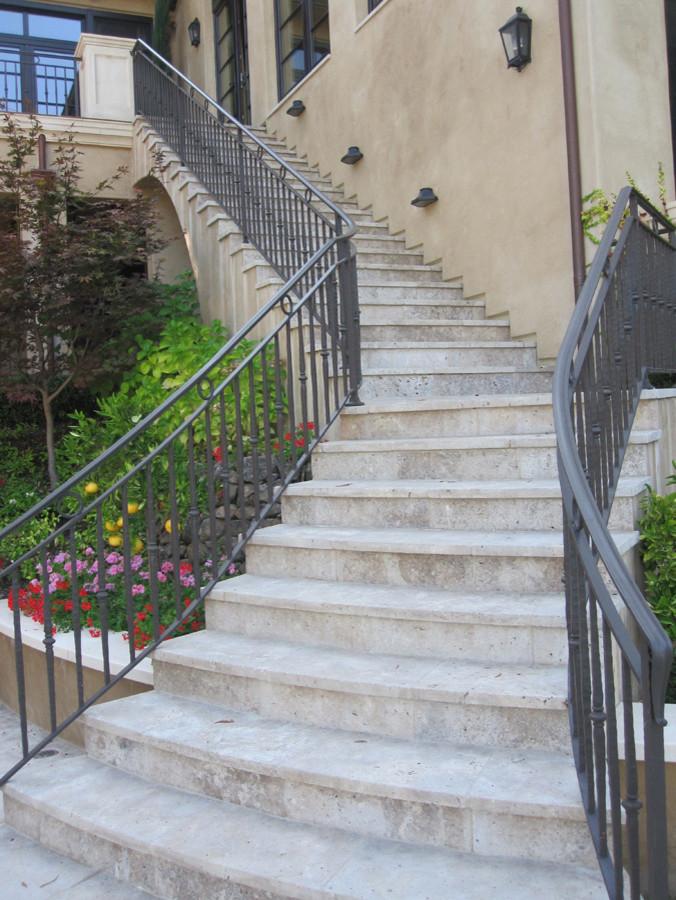 Photo of a large mediterranean staircase in San Francisco with metal railing.