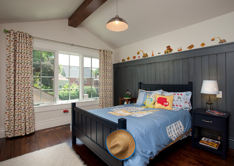 This is an example of a transitional kids' bedroom for kids 4-10 years old and boys in Salt Lake City with white walls and dark hardwood floors.
