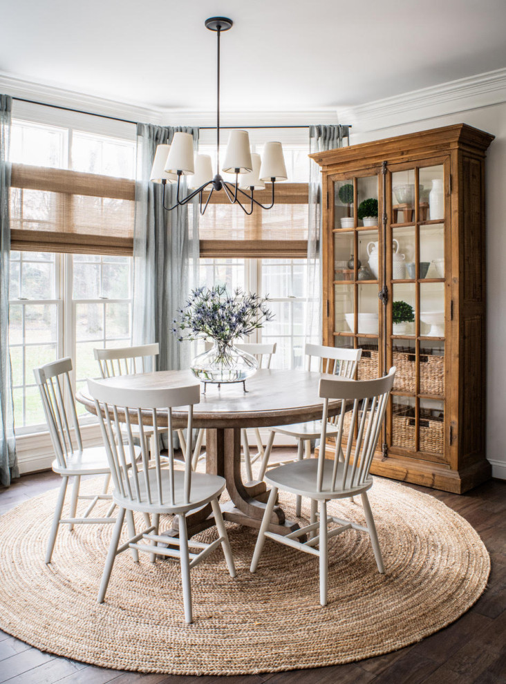 Inspiration for a transitional dark wood floor and brown floor dining room remodel with beige walls