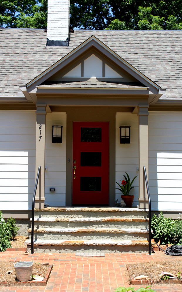 Inspiration for a small transitional front yard stone home design remodel