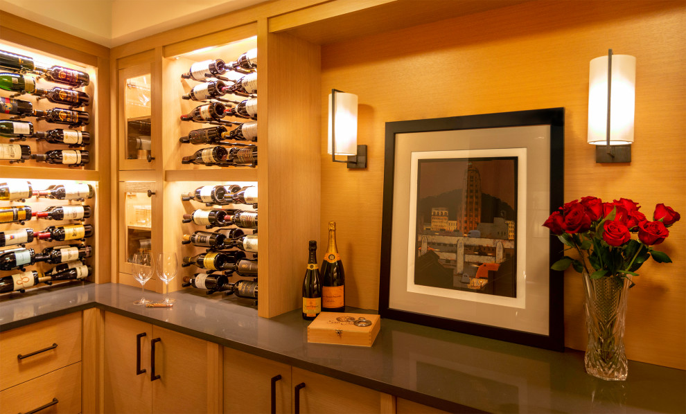 Photo of a transitional wine cellar in Seattle with terra-cotta floors, storage racks and black floor.