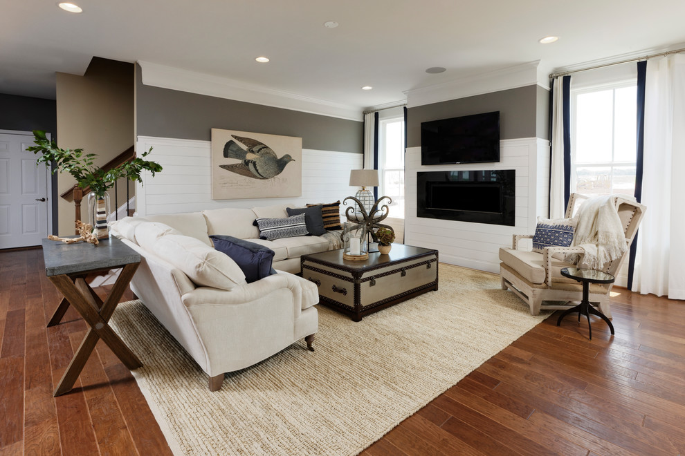 Photo of an expansive beach style formal open concept living room in DC Metro with multi-coloured walls, vinyl floors, a wall-mounted tv, brown floor, a ribbon fireplace and a wood fireplace surround.