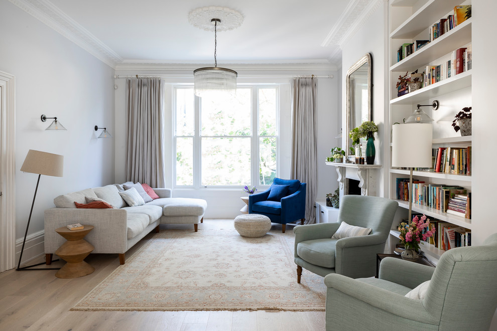 Inspiration for a transitional open concept living room in London with grey walls.