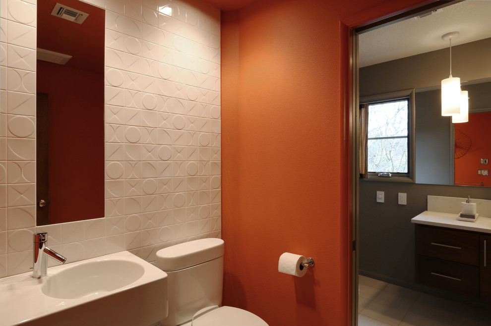 Inspiration for a mid-sized midcentury bathroom in Portland with white tile and orange walls.