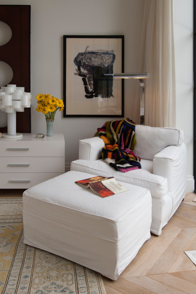 Huge trendy master light wood floor bedroom photo in Other with white walls