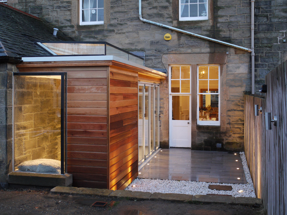 Design ideas for a large contemporary backyard deck in Edinburgh with no cover.