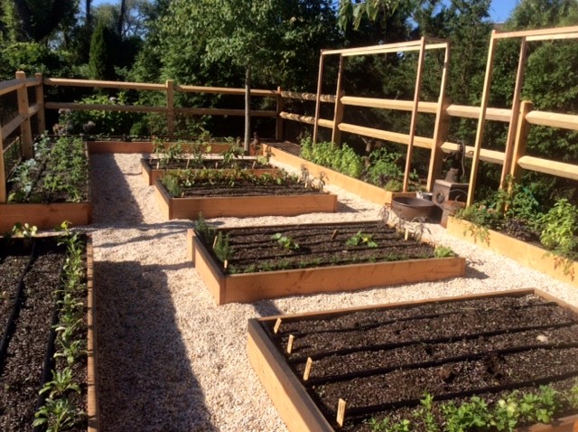 Design ideas for a large backyard full sun formal garden in New York with a vegetable garden.