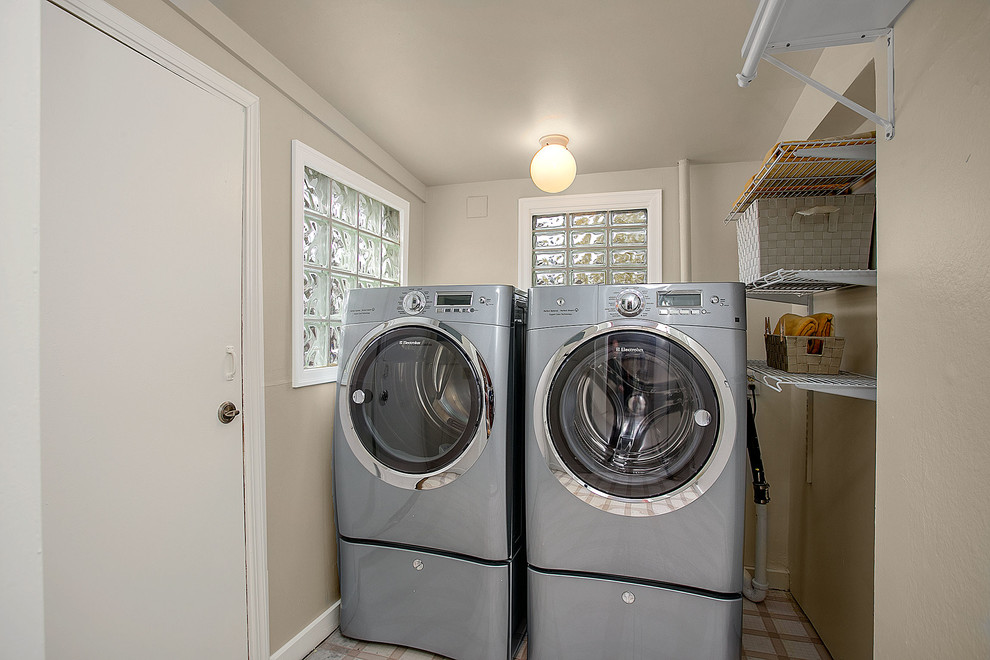 Transitional laundry room in Seattle.