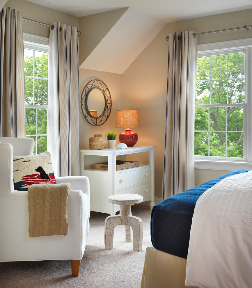 This is an example of a mid-sized beach style bedroom in Boston with carpet and blue walls.
