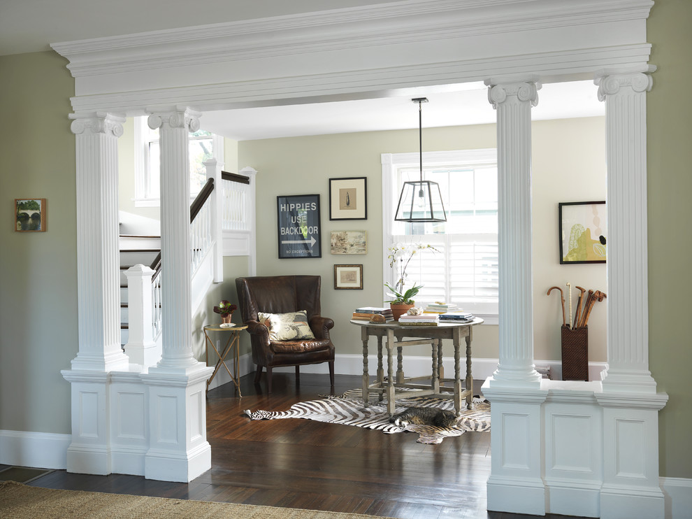 Design ideas for a traditional foyer in Providence with beige walls and dark hardwood floors.
