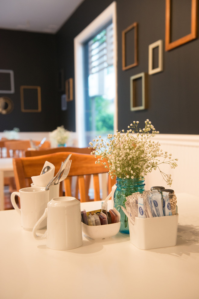 Transitional light wood floor dining room photo in Calgary with gray walls