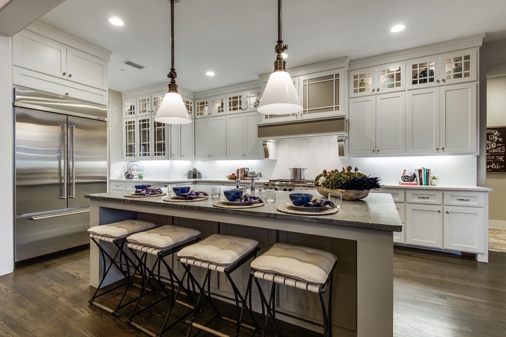 Photo of a large l-shaped open plan kitchen in Dallas with shaker cabinets, white cabinets and with island.