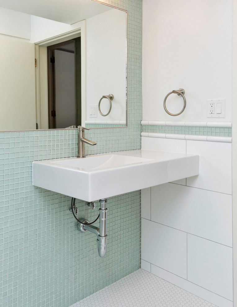 This is an example of a mid-sized modern master bathroom in Other with a curbless shower, a one-piece toilet, green tile, glass tile, white walls, ceramic floors and a wall-mount sink.