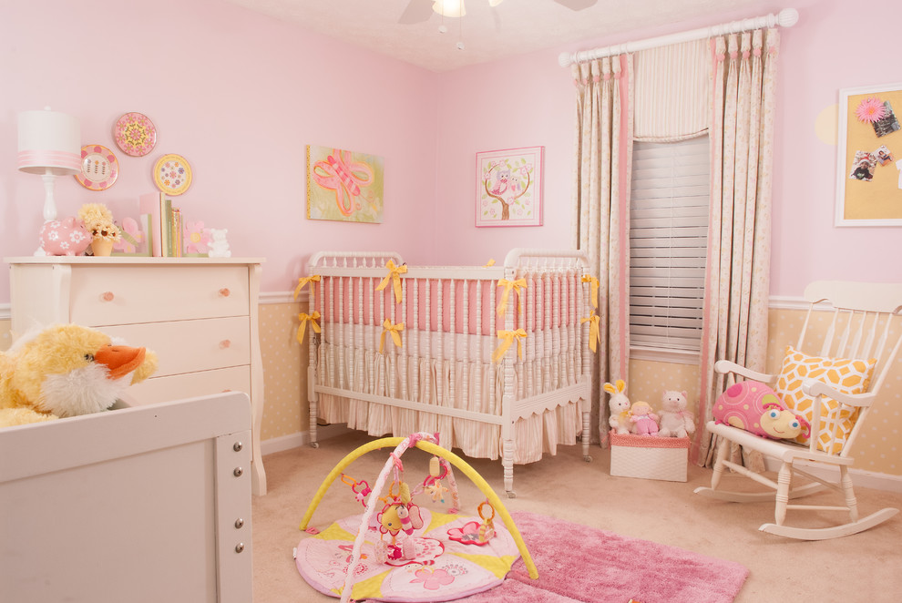 Design ideas for a mid-sized traditional nursery for girls in Atlanta with pink walls, carpet and pink floor.