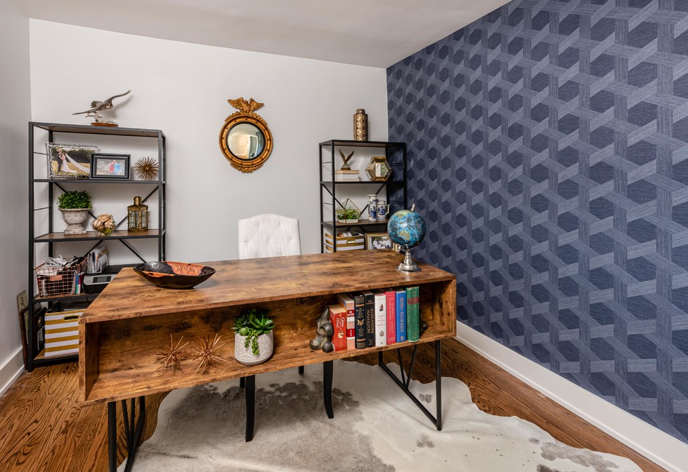 Photo of a mid-sized transitional home office in DC Metro with multi-coloured walls, dark hardwood floors, no fireplace, a freestanding desk and brown floor.