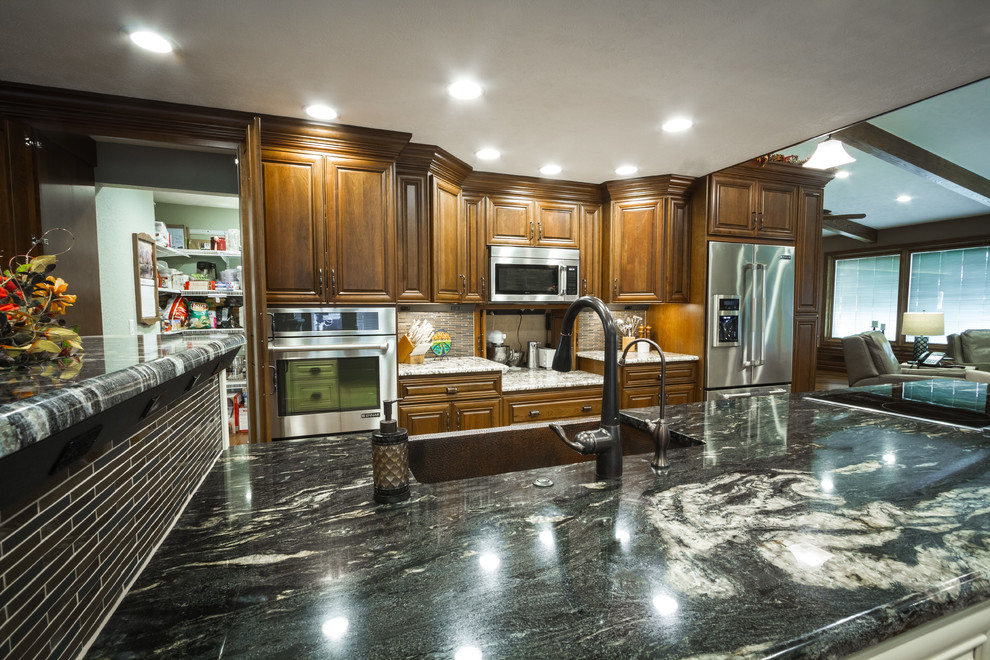 Example of a large transitional l-shaped eat-in kitchen design with a farmhouse sink and two islands