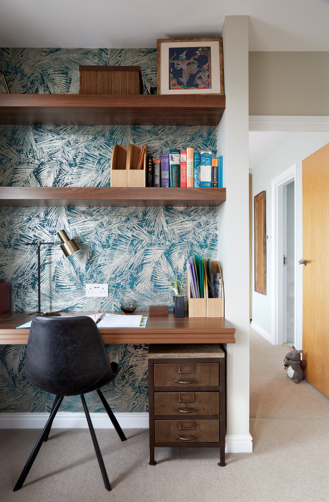 Small contemporary study room in London with carpet, a built-in desk, beige floor and wallpaper.