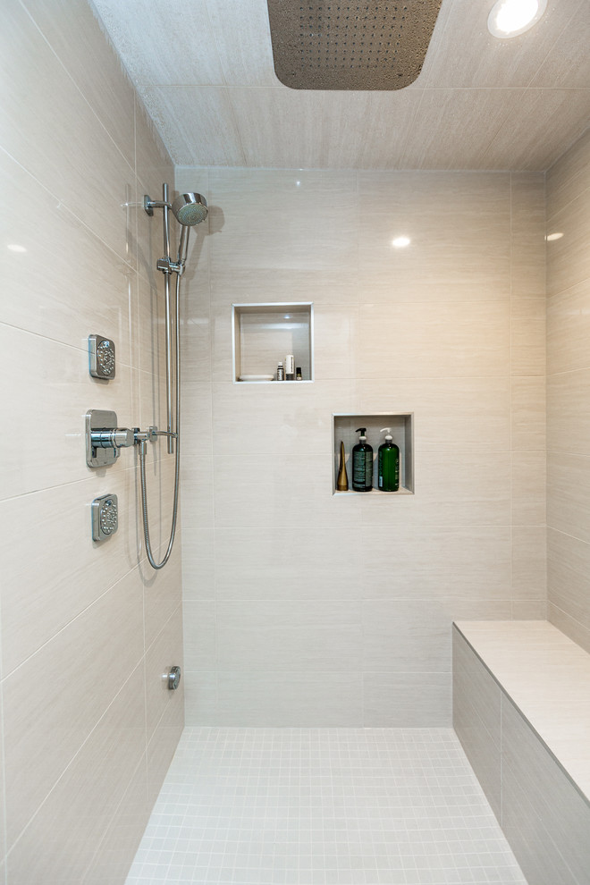Photo of a mid-sized traditional master bathroom in Calgary with shaker cabinets, medium wood cabinets, an alcove shower, beige tile, porcelain tile, beige walls, porcelain floors, an undermount sink and granite benchtops.