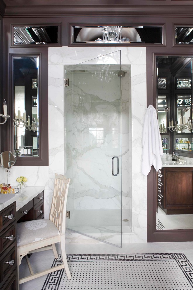 This is an example of a traditional bathroom in Denver with dark wood cabinets and an alcove shower.