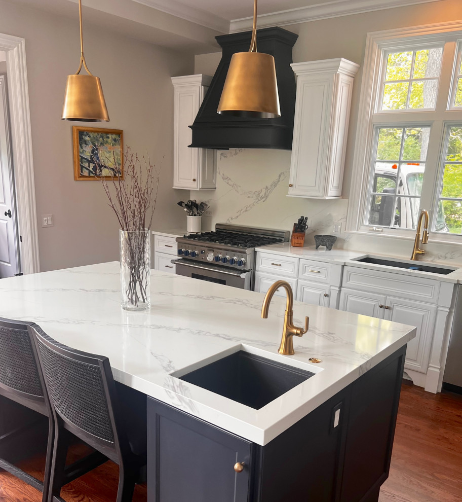 Eat-in kitchen - mid-sized transitional galley dark wood floor and brown floor eat-in kitchen idea in Chicago with an undermount sink, raised-panel cabinets, white cabinets, quartzite countertops, multicolored backsplash, quartz backsplash, stainless steel appliances, an island and white countertops