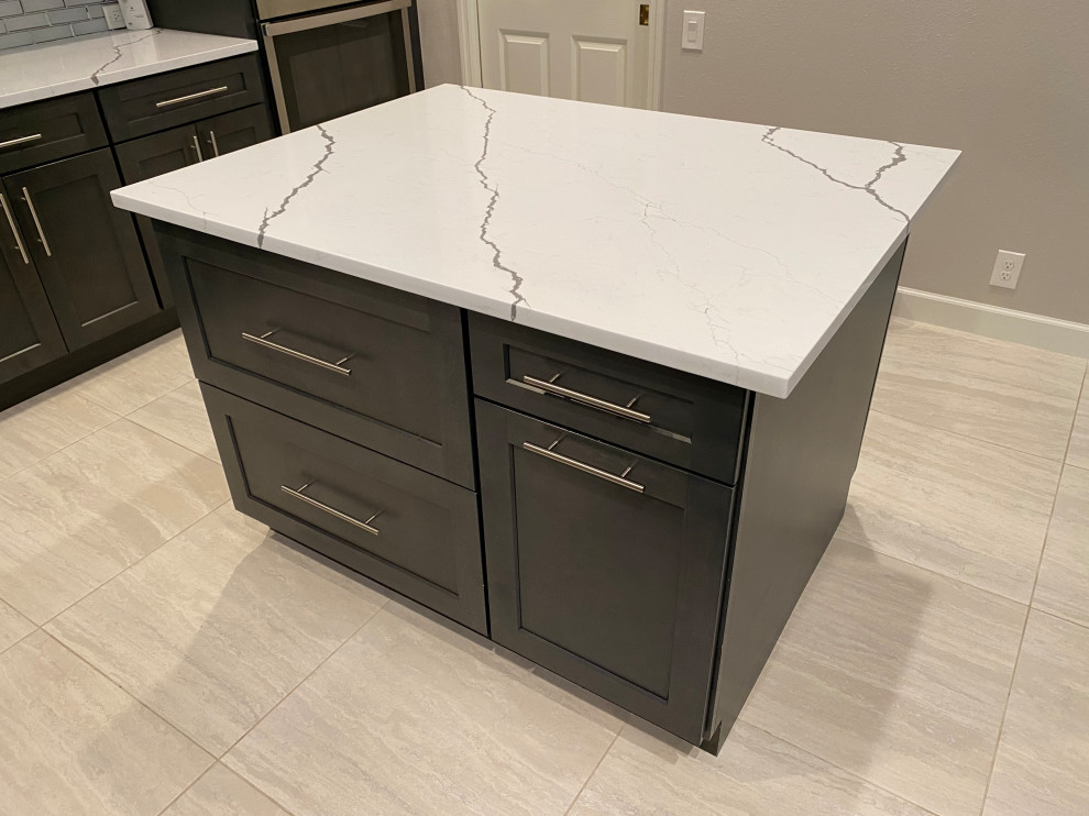 Eat-in kitchen - large transitional porcelain tile and beige floor eat-in kitchen idea in Tampa with a single-bowl sink, shaker cabinets, dark wood cabinets, quartzite countertops, gray backsplash, subway tile backsplash, stainless steel appliances, an island and white countertops