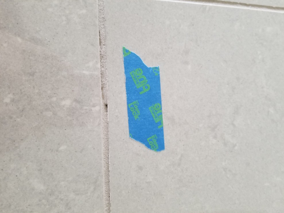 Pinholes in grout what should I expect from contractor?