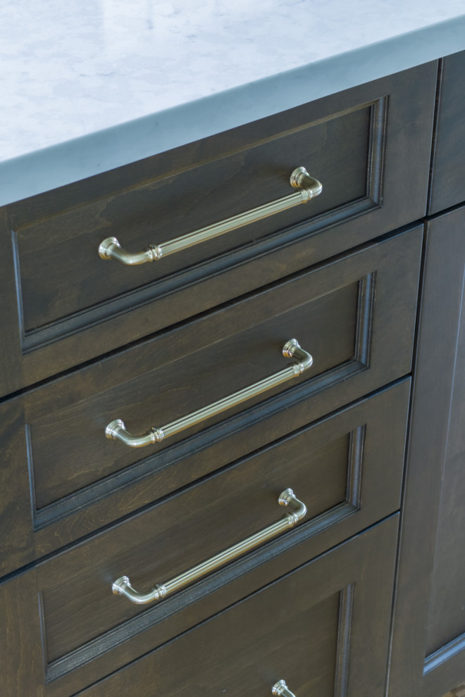 Inspiration for a mid-sized transitional kitchen remodel in Chicago with a double-bowl sink, recessed-panel cabinets, dark wood cabinets, an island and white countertops