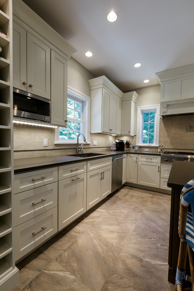 Mid-sized mountain style l-shaped porcelain tile and beige floor open concept kitchen photo in Bridgeport with an undermount sink, shaker cabinets, white cabinets, granite countertops, beige backsplash, porcelain backsplash, stainless steel appliances and an island