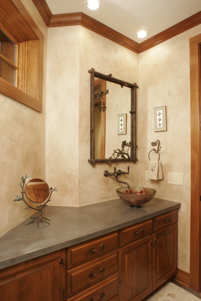 Inspiration for a mid-sized country powder room in Other with a vessel sink, raised-panel cabinets, medium wood cabinets, quartzite benchtops and beige walls.