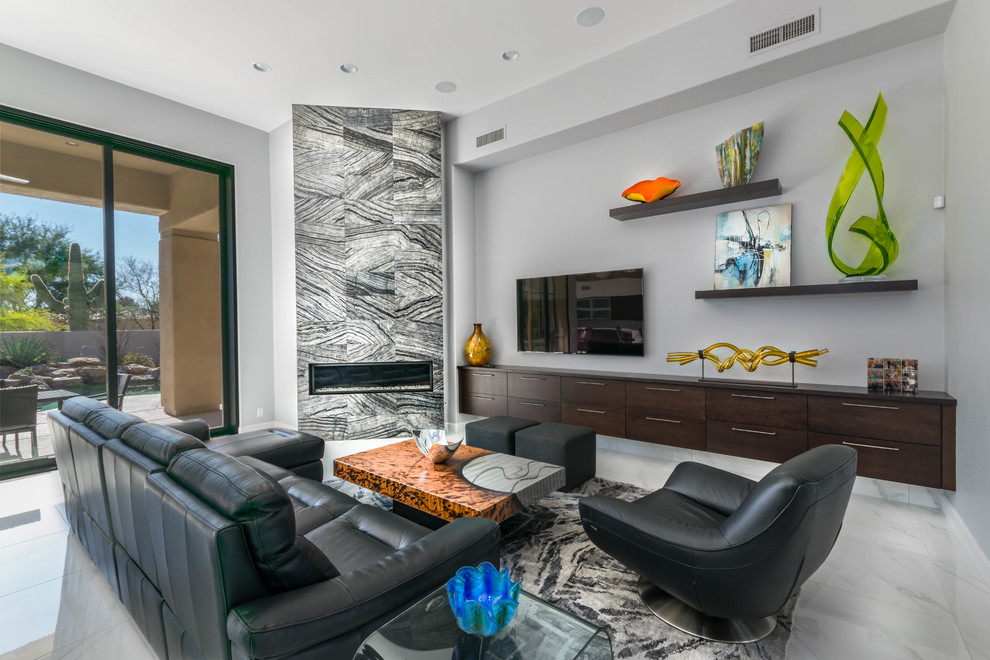 This is an example of a large transitional open concept family room in Phoenix with grey walls, marble floors, a corner fireplace, a tile fireplace surround and a wall-mounted tv.