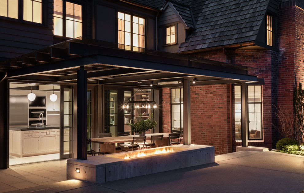 Design ideas for a large transitional backyard patio in Seattle with a fire feature, concrete pavers and a pergola.