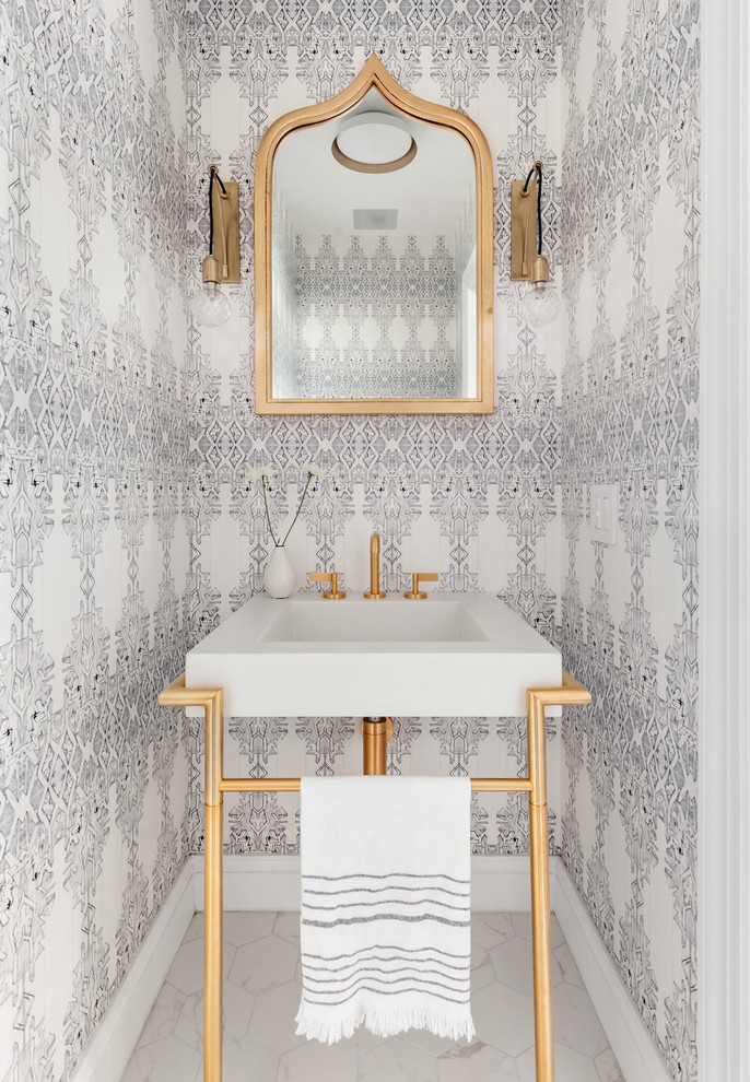 Scandinavian powder room in New York with multi-coloured walls, a console sink and white floor.
